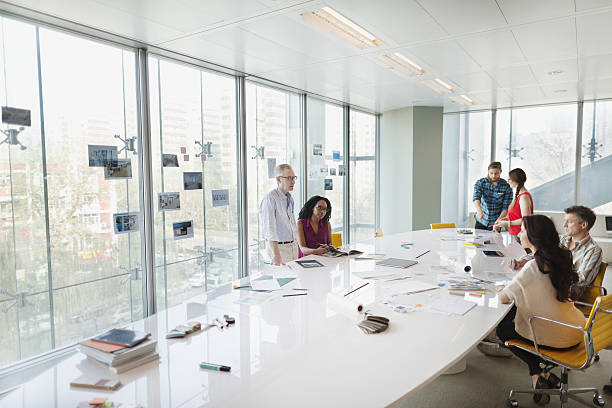 Business colleagues talking in planning meeting conference room